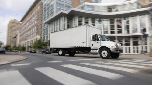 box truck driving through the city