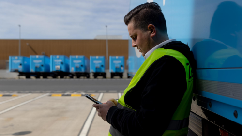man using Relay tech while in a truck yard of Prime trailers