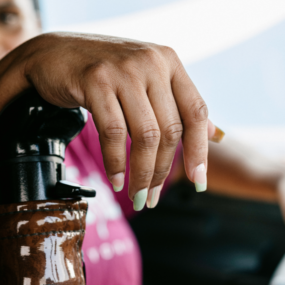 close-up of woman's hand on semi-truck shift