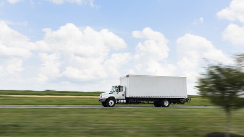 white box truck driving through the country.jpg
