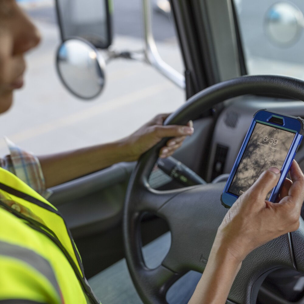 driver on phone in box truck