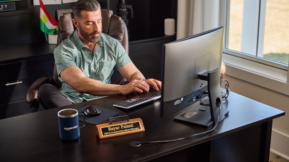 Bayar Palani at his desk in his office