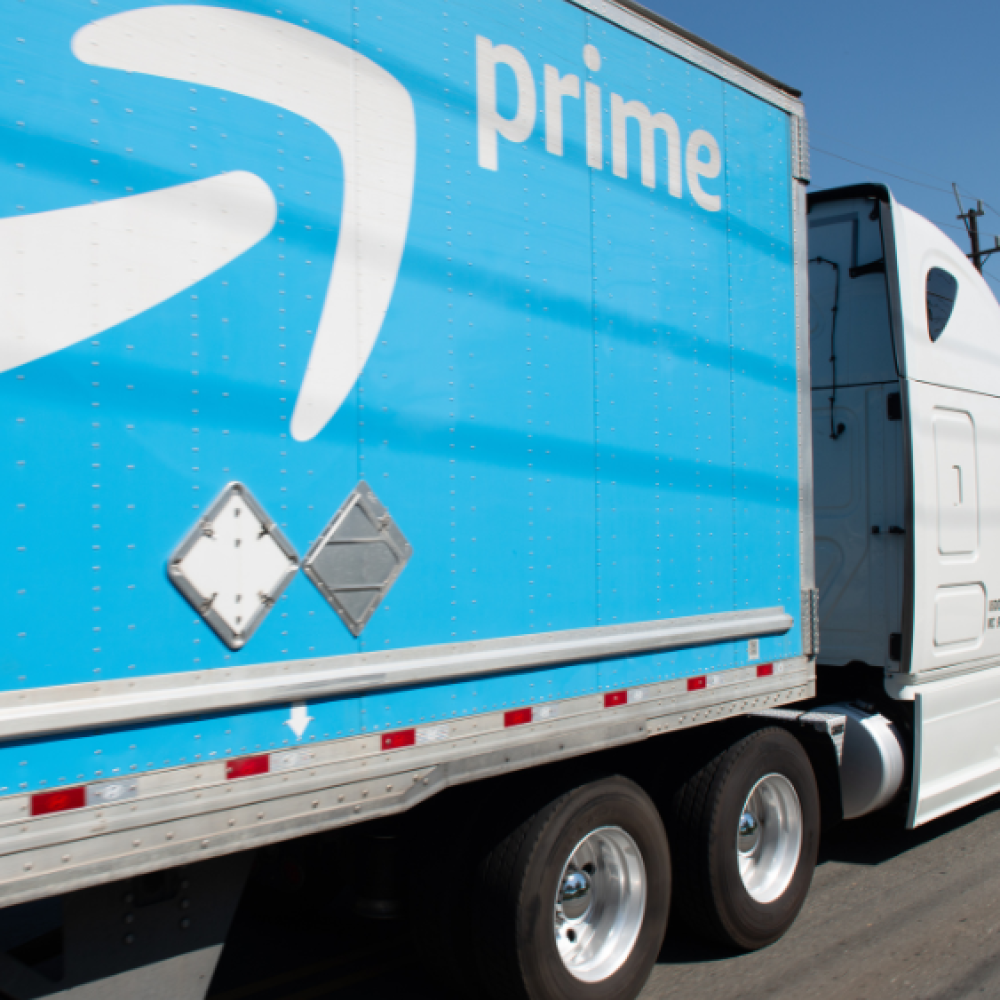 close up of amazon prime trailer being hauled on highway