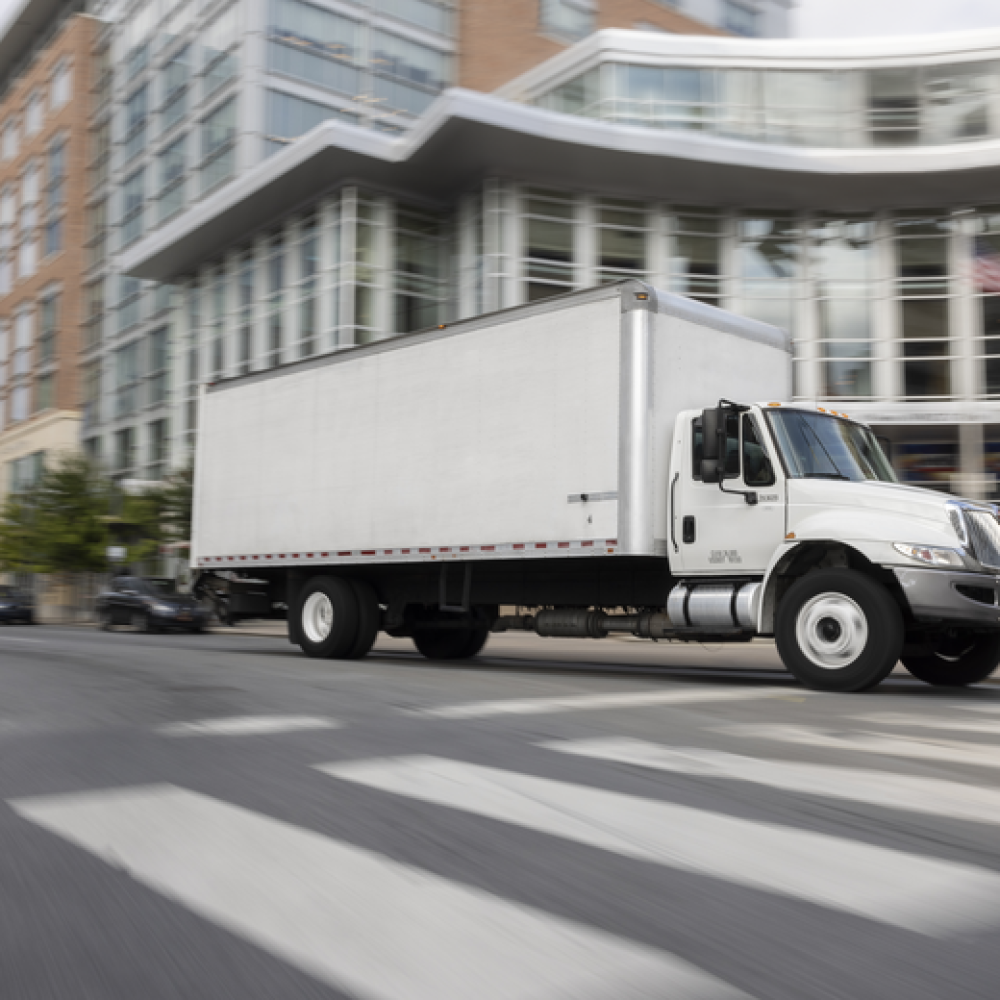 box truck driving through the city