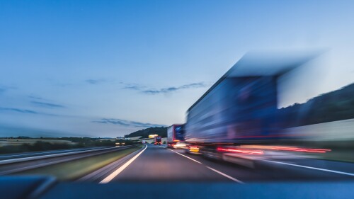 blurry amazon prime trailer on highway.jpeg