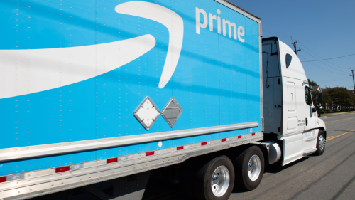 close up of amazon prime trailer being hauled on highway