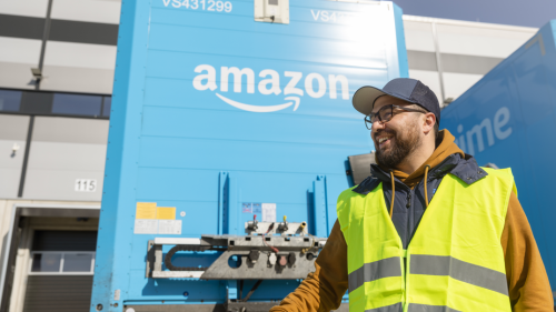 trucker wearing safety equipment in an amazon truck yard